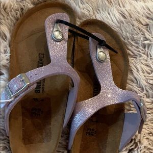Child’s purple Birkenstocks